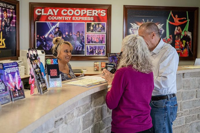 Guests booking show tickets at the counter