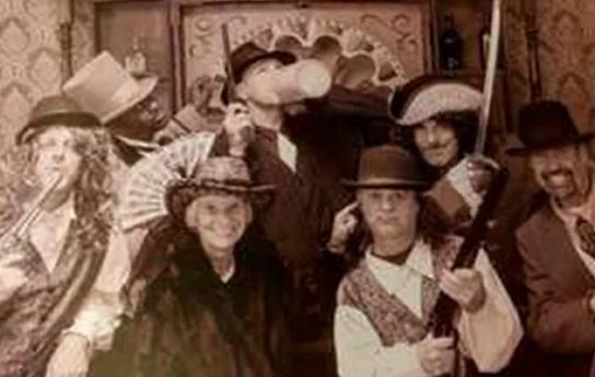 A family in costume for an old time photo