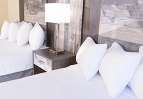 Pillows and bedside lamp in the King room