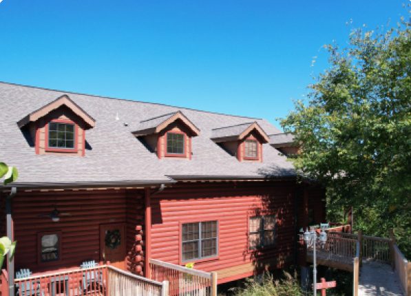 Cabins at Grand Mountain — red log cabin exterior